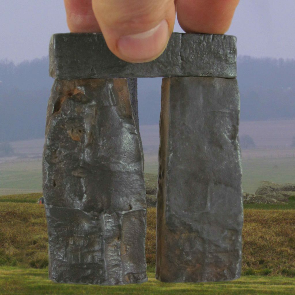 Trilithon Two, Stonehenge 76th scale rusty iron cold cast, fingers for scale on grass