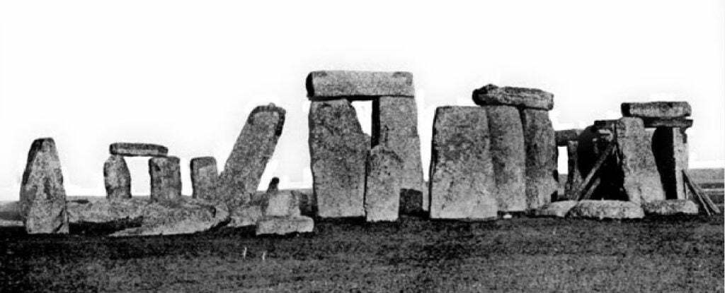 view of Stonehenge showing leaning stone 56 and timber supports