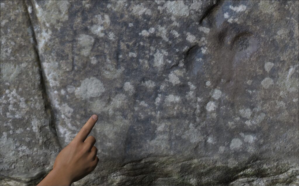 Close up of Stonehenge's Stone 55b showing a hand for scale with the graffiti Iane Fleming